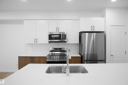 #101 3715 141 St Sw, Edmonton, AB - Indoor Photo Showing Kitchen With Stainless Steel Kitchen With Double Sink With Upgraded Kitchen