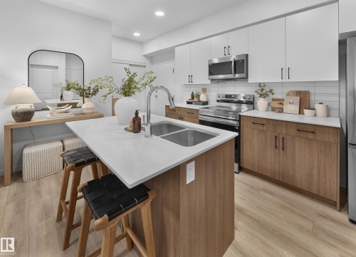105 3715 141 Street, Edmonton, AB - Indoor Photo Showing Kitchen With Stainless Steel Kitchen With Double Sink With Upgraded Kitchen