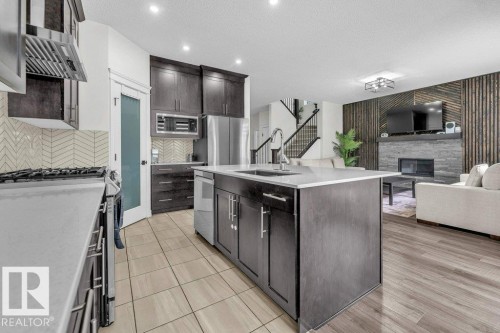 2107 14 Avenue, Edmonton, AB - Indoor Photo Showing Kitchen With Fireplace With Upgraded Kitchen