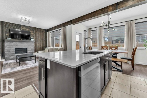 2107 14 Avenue, Edmonton, AB - Indoor Photo Showing Kitchen With Fireplace With Upgraded Kitchen