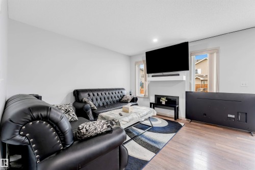 3048 16 Avenue, Edmonton, AB - Indoor Photo Showing Living Room With Fireplace