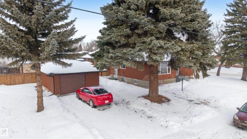 View of snowy exterior featuring a garage - 12202 45 Street, Edmonton, AB - Outdoor