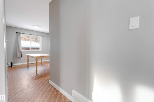 Corridor with baseboards - 12202 45 Street, Edmonton, AB - Indoor Photo Showing Other Room