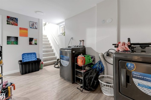 Miscellaneous room featuring light wood-type flooring and stairway - 12202 45 Street, Edmonton, AB - Indoor