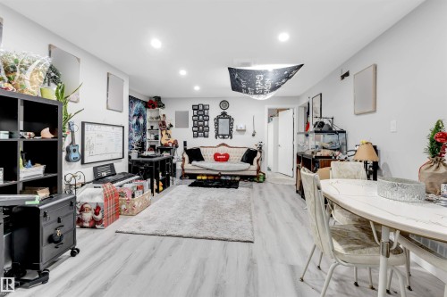 Living area featuring recessed lighting and light wood-type flooring - 12202 45 Street, Edmonton, AB - Indoor
