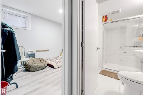 Bathroom with a marble finish shower and toilet - 12202 45 Street, Edmonton, AB - Indoor Photo Showing Bathroom