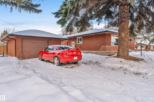 View of front of house with a garage and an outdoor structure - 12202 45 Street, Edmonton, AB - Outdoor