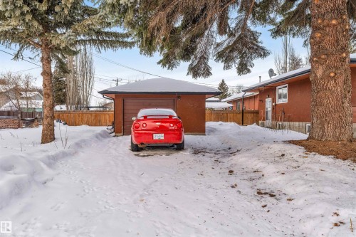 Snow covered garage featuring a detached garage - 12202 45 Street, Edmonton, AB - Outdoor