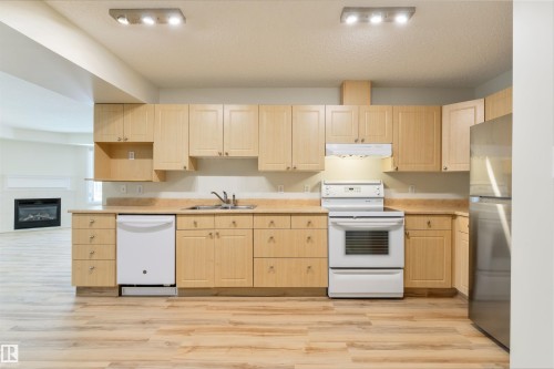 112 10311 111 Street, Edmonton, AB - Indoor Photo Showing Kitchen With Double Sink