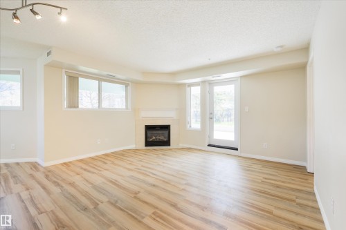 112 10311 111 Street, Edmonton, AB - Indoor Photo Showing Living Room With Fireplace