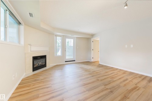 112 10311 111 Street, Edmonton, AB - Indoor Photo Showing Living Room With Fireplace