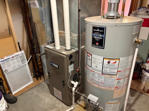 York furnace and Bradford White hot water heater - 410 Main St, Alcomdale, AB - Indoor Photo Showing Basement