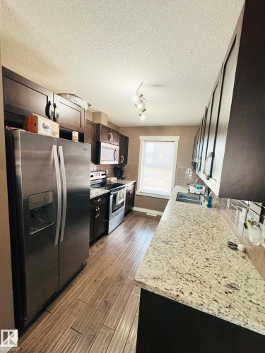 311 401 Southfork Drive, Leduc, AB - Indoor Photo Showing Kitchen With Double Sink