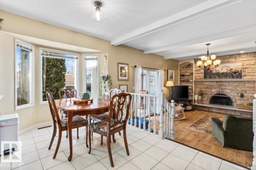 2446 78 Street, Edmonton, AB - Indoor Photo Showing Dining Room With Fireplace