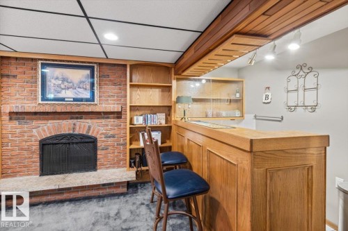 2446 78 Street, Edmonton, AB - Indoor Photo Showing Other Room With Fireplace