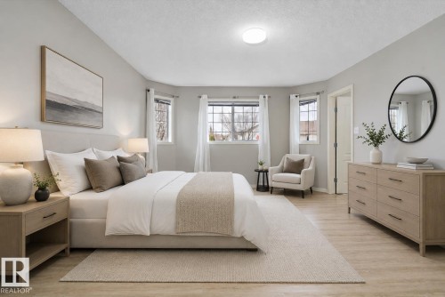 Spacious room featuring light wood-finish flooring and a neutral color palette - 15109 Miller Boulevard, Edmonton, AB - Indoor Photo Showing Bedroom