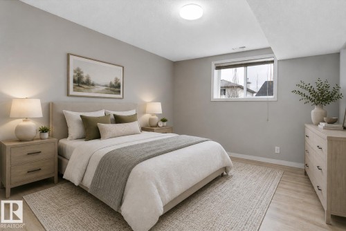 Bedroom featuring light wood-finish flooring, a neutral wall color, and a window with white trim - 15109 Miller Boulevard, Edmonton, AB - Indoor Photo Showing Bedroom