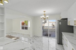 Open-concept living space with marble-finish flooring - 