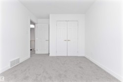 Light grey carpeting providing a neutral foundation for the room - 