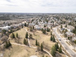 Extensive residential area featuring varied architectural styles and mature tree coverage - 