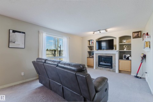 3534 Mclean Crescent, Edmonton, AB - Indoor Photo Showing Living Room With Fireplace