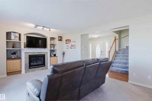 3534 Mclean Crescent, Edmonton, AB - Indoor Photo Showing Living Room With Fireplace