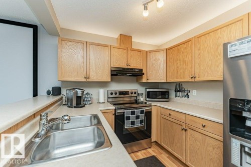 13806 38 Street, Edmonton, AB - Indoor Photo Showing Kitchen With Double Sink