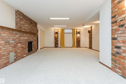 Spacious grassy yard featuring mature evergreen trees - 11423 50 Avenue, Edmonton, AB - Outdoor