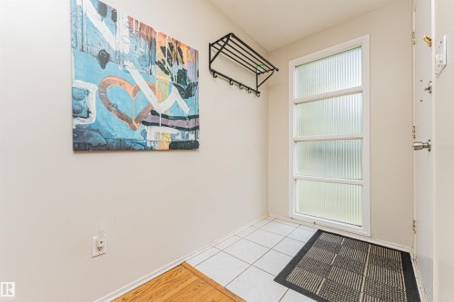 Hardwood flooring throughout the main living area - 11423 50 Avenue, Edmonton, AB - Indoor Photo Showing Other Room
