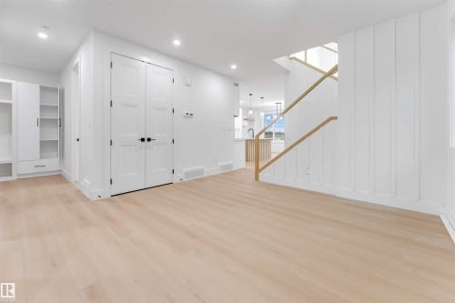 The interior features light-toned flooring, white walls, and recessed lighting - 4004 35 Street, Beaumont, AB - Indoor Photo Showing Other Room