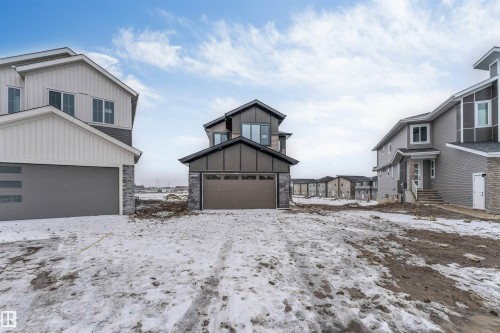 The property features a contemporary architectural style with multiple windows - 4004 35 Street, Beaumont, AB - Outdoor