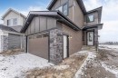 The property features a modern exterior with varied siding materials, including horizontal siding, vertical panels, and stone accents - 4004 35 Street, Beaumont, AB  - Outdoor 