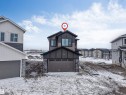 The property features a dark-toned exterior with lighter brown accents and a two-story design - 4004 35 Street, Beaumont, AB  - Outdoor 