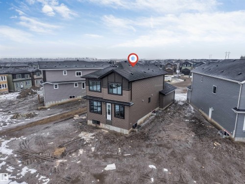 This property features a contemporary exterior with dark siding and contrasting trim - 4004 35 Street, Beaumont, AB - Outdoor
