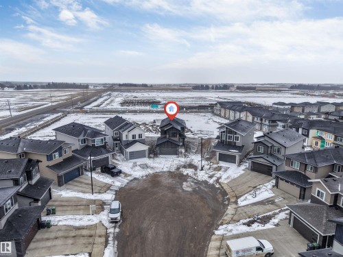 Aerial view of the property in a cul-de-sac, featuring a two-story design and an attached garage - 4004 35 Street, Beaumont, AB - Outdoor With View