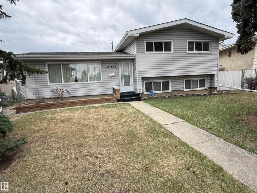 Two-story residence featuring light gray siding exterior and white trim - 12916 95A Street, Edmonton, AB - Outdoor With Facade