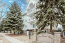 The property is a low-rise building featuring a light-colored facade with white trim and balconies - 25 9926 80 Avenue, Edmonton, AB  - Outdoor With Balcony 
