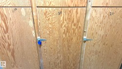 Storage lockers with natural wood grain doors and metal latch hardware - 