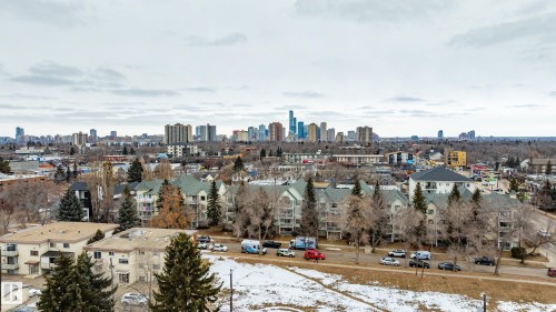 Panoramic view of the urban landscape, featuring distant city skyline and surrounding buildings - 25 9926 80 Avenue, Edmonton, AB - Outdoor With View