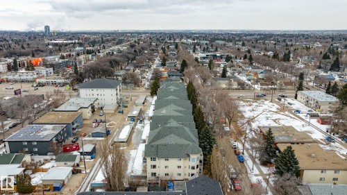 Aerial view of the neighborhood showcasing surrounding properties and mature trees - 25 9926 80 Avenue, Edmonton, AB - Outdoor With View