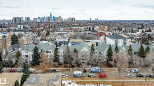 The property offers expansive views of the city skyline and surrounding neighborhood - 25 9926 80 Avenue, Edmonton, AB - Outdoor With View