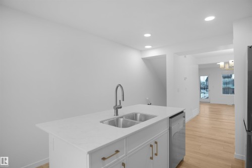 3-1211 Keswick Drive, Edmonton, AB - Indoor Photo Showing Kitchen With Double Sink