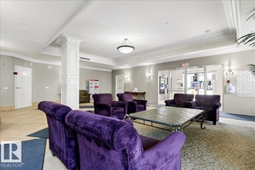 Lobby with tile flooring, crown molding, decorative columns, and recessed lighting - 701 9707 105 Street, Edmonton, AB - Indoor