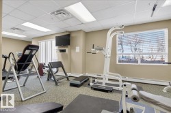 Dedicated fitness room featuring patterned carpeting and a window with blinds - 