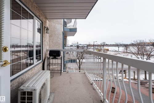View of snow covered back of property - 309 13450 114 Avenue, Edmonton, AB - Outdoor With Balcony With Exterior