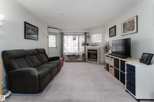 309 13450 114 Avenue, Edmonton, AB - Indoor Photo Showing Living Room With Fireplace