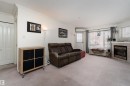 309 13450 114 Avenue, Edmonton, AB  - Indoor Photo Showing Living Room With Fireplace 