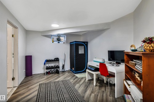 Finished room featuring wood-finish flooring, recessed lighting, and a white painted ceiling - 96 Bonin Crescent, Beaumont, AB - Indoor Photo Showing Office