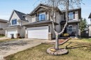 Two-story siding exterior with dark shingle roofing, featuring a built-in single-car garage and a concrete driveway - 96 Bonin Crescent, Beaumont, AB  - Outdoor With Facade 