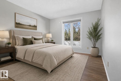 Bedroom featuring wood-finish flooring, light grey walls, and a large window with white trim - 46 903 109 Street, Edmonton, AB - Indoor Photo Showing Bedroom